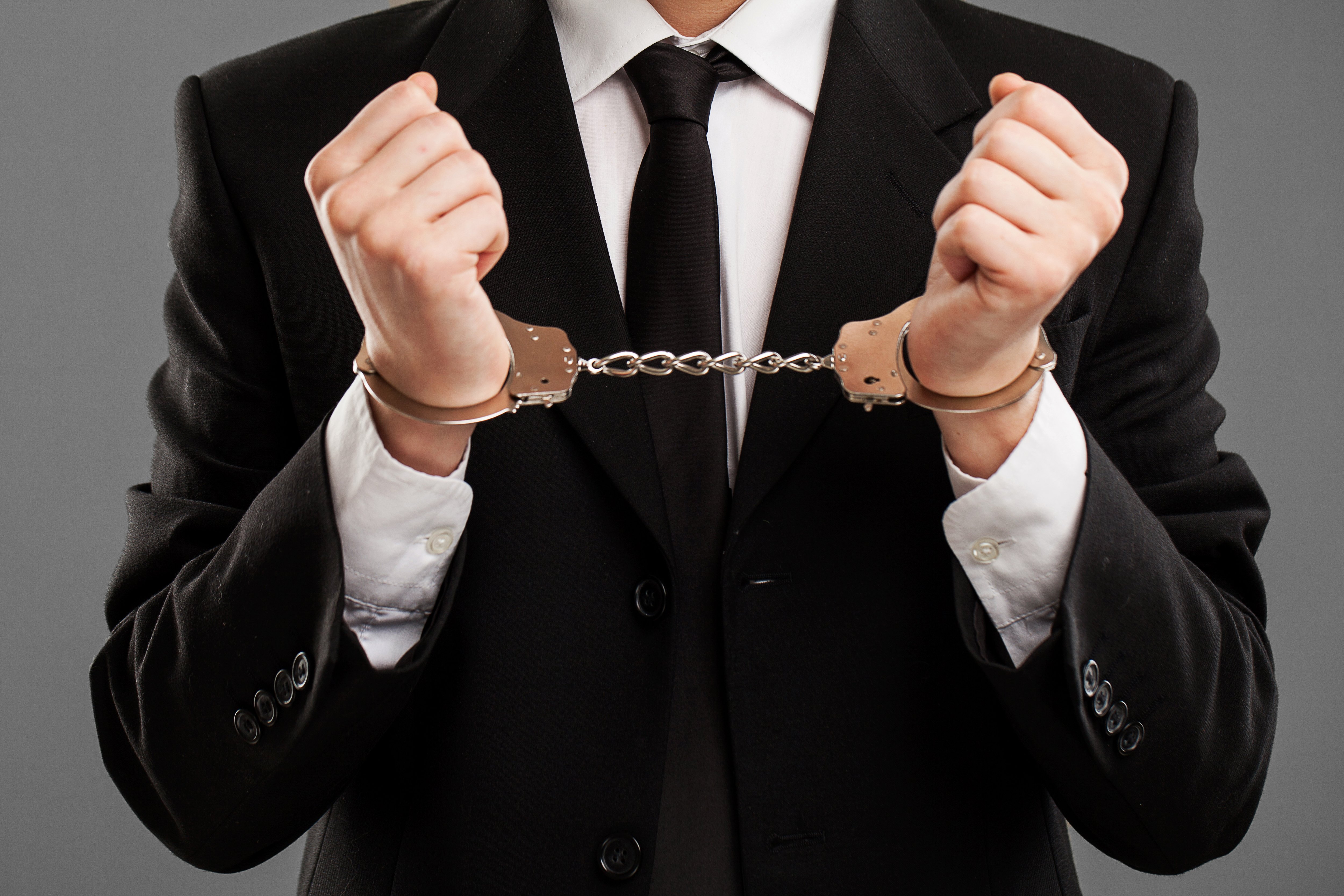 businessman-with-manacles-on-his-hands